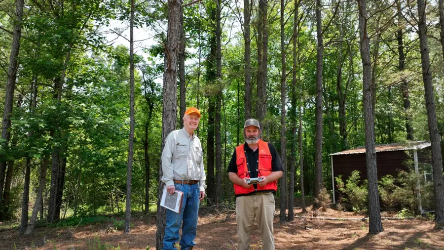 Eric Entrekin reviewing a stand map with a landowner