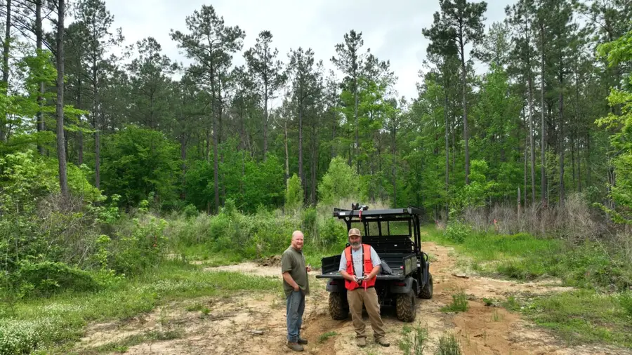 Eric Entrekin with a client on a spring timber trail