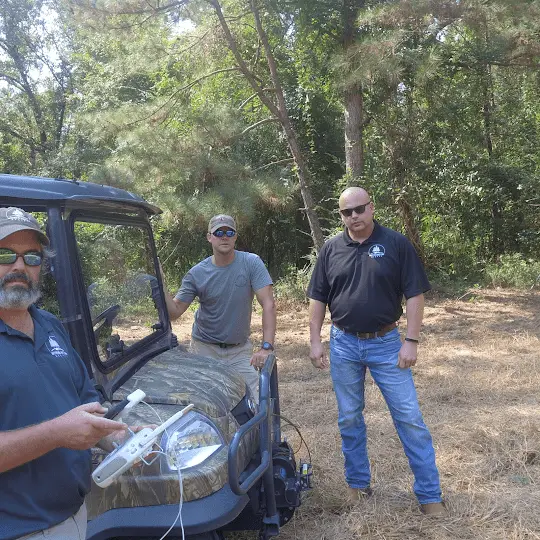 Eric Entrekin and team on a UTV in summer