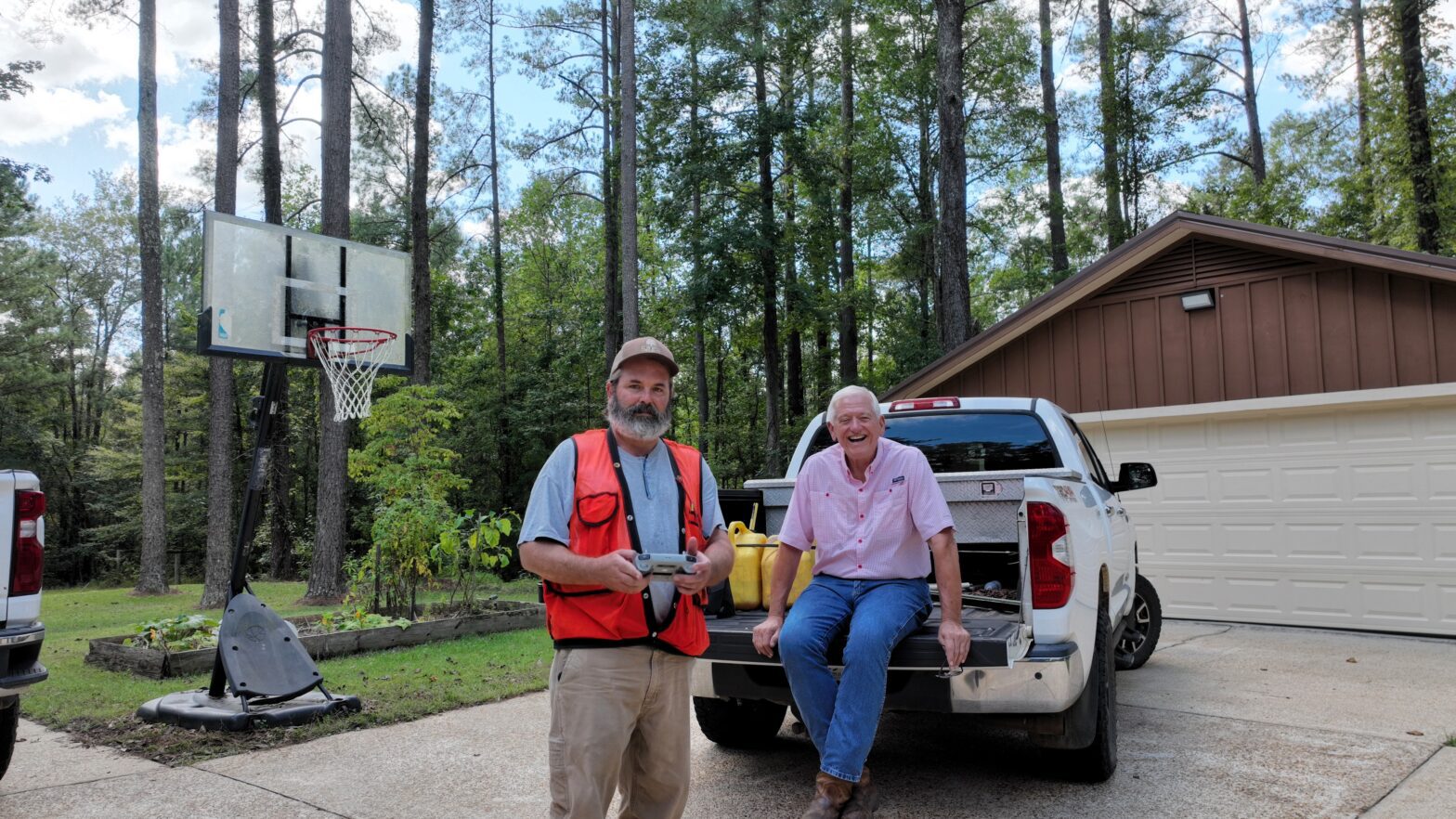 Southeast Forestlands consulting forester meeting with a landowner in Fayette County Alabama, using a drone to evaluate timber, discuss forest management strategies, and plan future forestry decisions, representing #TheTimberlandMan leadership in real-world forestry work.
